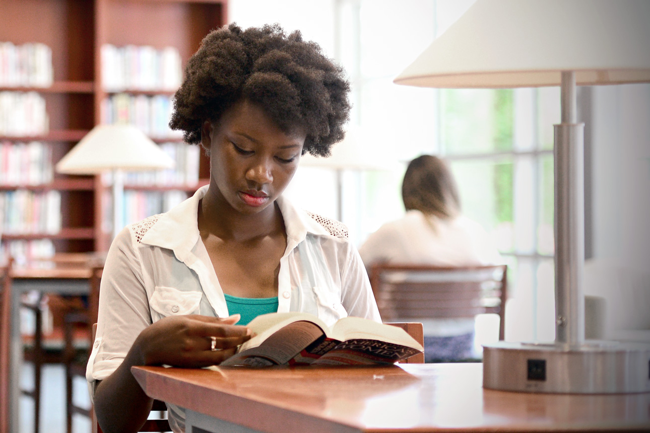 student reading in library in-line