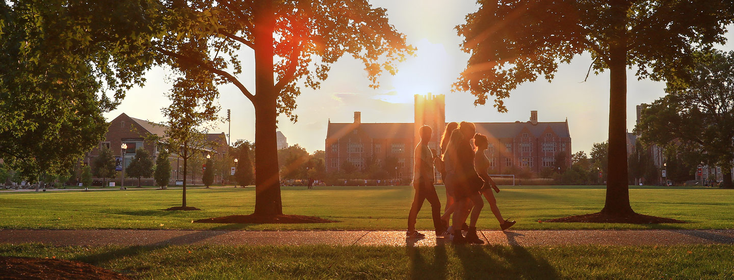 group of students walking on campus featured