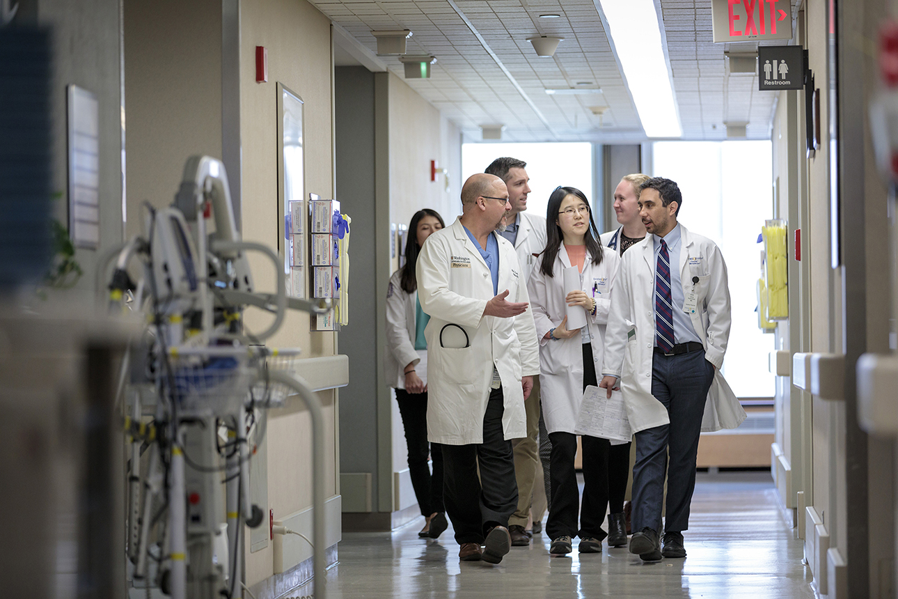 School of Medicine medical team walking and talking in a hospital